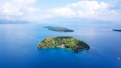 Aerial drone bird's eye view photo of iconic port of Nidri or Nydri a safe harbor for sail boats and famous for trips to Meganisi, Skorpios and other Ionian islands, Leflkada island, Ionian, Greece