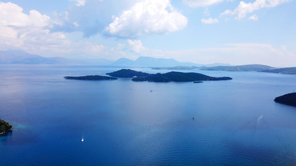 Fototapeta na wymiar Aerial drone bird's eye view photo of iconic port of Nidri or Nydri a safe harbor for sail boats and famous for trips to Meganisi, Skorpios and other Ionian islands, Leflkada island, Ionian, Greece