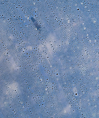 Background of the condensate drops on the film is polyethylene. Water drops texture