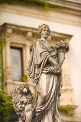 Fototapeta na wymiar Romania, Sinaia. Stone statues at 19th Century Peles Castle. 