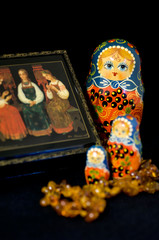 Russia, Russian handicrafts. Traditional painted Russian lacquer box, amber necklace & matryoshka...