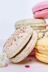 Few colored macarons on a white background