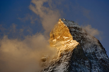 Clouds around the summit of the Matterhorn at sunrise, Zermatt, Switzerland