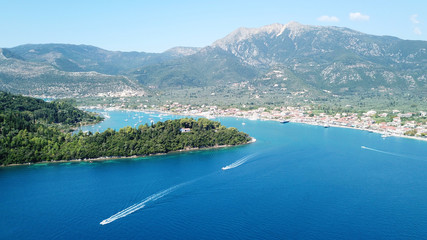 Aerial drone bird's eye view photo of iconic port of Nidri or Nydri a safe harbor for sail boats and famous for trips to Meganisi, Skorpios and other Ionian islands, Leflkada island, Ionian, Greece