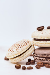 Few colored macarons on a white background