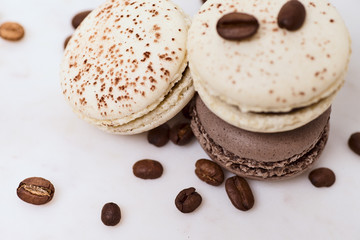 Few colored macarons on a white background