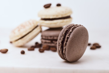 Few colored macarons on a white background