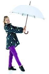 Cute little girl with umbrella. Weather forecast concept.