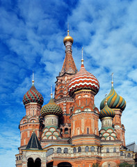 Fototapeta na wymiar Russia, Moscow. The ornate spires of St. Basil's Cathedral, a World Heritage Site, on Red Square rise against a brilliant summer sky, in Moscow, Russia.