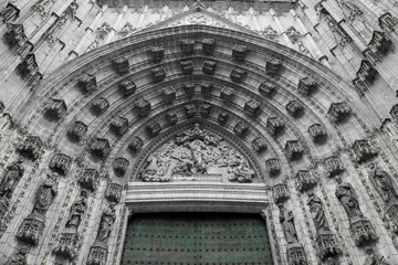 Spain, Andalusia, Seville. Gothic architecture of the cathedral door.