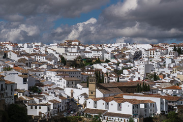 Fototapeta na wymiar Spain, Andalusia, Ronda. Known for a striking bridge that crosses a ravine and divides the town in two, Ronda is a classic example of a whitewashed hilltop village along the White Road.