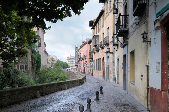 Spain, Andalusia, Granada. Old cobblestone street in Granada.