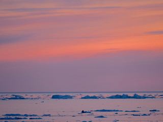 Ilulissat Icefjord also called kangia or Ilulissat Kangerlua, sunset over Disko Bay. The icefjord...