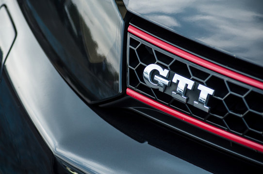 Closeup of GTI sign on black Golf GTI front parked in the street