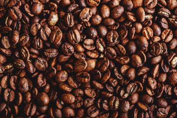 Coffee grains. Background of roasted coffee beans brown. layout. Flat lay.