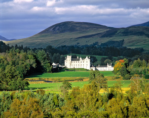 Scotland, Tayside, Blair Castle. In an emerald green field, against a backdrop of heathered hills,...