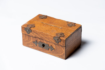 Vintage handmade wooden box with lock on white background.