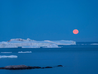 Full Moon. Ilulissat Icefjord also called kangia or Ilulissat Kangerlua at Disko Bay. The icefjord...