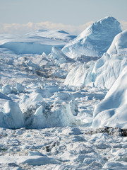 Fototapeta na wymiar Ilulissat Icefjord also called kangia or Ilulissat Kangerlua at Disko Bay. The icefjord is listed as UNESCO World Heritage Site.