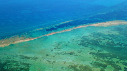 Fototapeta na wymiar Aerial drone bird's eye view photo of tropical caribbean paradise bay and lagoon with white sandy beach and turquoise clear sea
