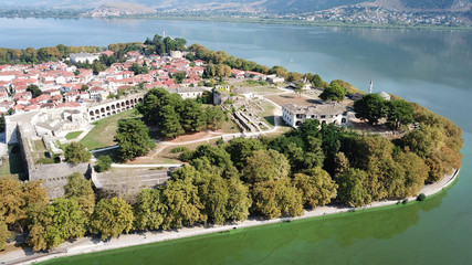 Aerial drone bird's eye view photo of iconic city and castle and mosque of Ioannina surounded by famous lake and mountains of Pindus, Epirus, Greece