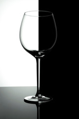 Empty wine glasses isolated on black and white  background. Wine list design menu with copy space.