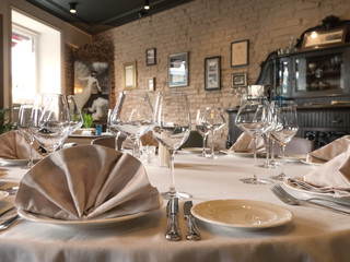 Empty wine glasses are served on the table