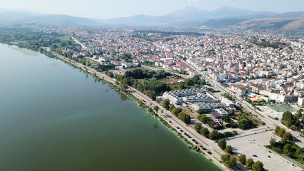 Fototapeta premium Aerial drone bird's eye view photo of iconic city and castle and mosque of Ioannina surounded by famous lake and mountains of Pindus, Epirus, Greece