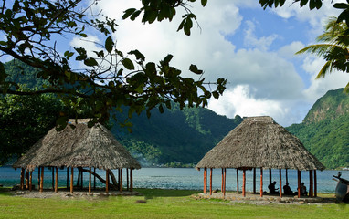 Traditional faleo'o on the bay shore, Pago Pago, Tutuila Island, American Samoa.