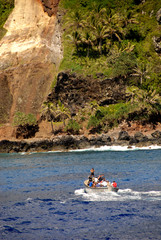South Pacific, British Overseas Teritory, Pitcairn Island. With only 50 residents, Pitcairn is notable for being the least polulated jurisdiction in the world. Local residents in long boat.
