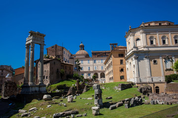Fototapeta na wymiar Ruins of the Temple of Apollo Sosianus and the Santa Rita da Cascia in Campitelli church