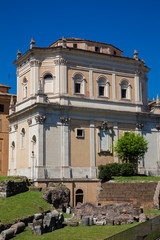 Obraz premium Santa Rita da Cascia in Campitelli church and the ruins of the Temple of Apollo Sosianus