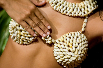 French Polynesia. Details of traditional jewelry worn with Tahitian dancing costume.