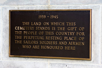 Papua New Guinea, Lae. War Cemetery Memorial Plaque in English.