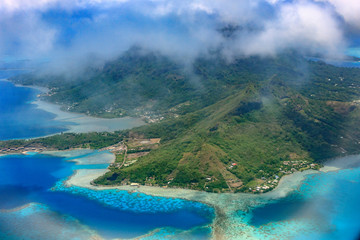 Aerial with lagoon and hotels over the Water. Bora Bora. French Polynesia.