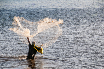 Man fishing in the harbor of Apia, Upolu, Samoa, South Pacific