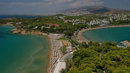 Fototapeta na wymiar Aerial drone photo from famous Astir or Asteras sandy beach in south Athens riviera, Vouliagmeni Peninsula, Greece