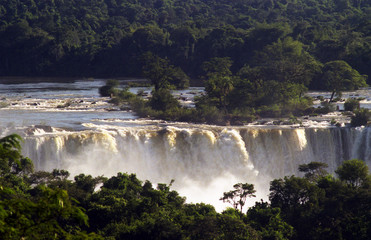 Foz do IguaÁu, Parana, Brazil. The Argentina side of Iguacu Falls taken from the Brazil side. The 275 falls are higher then Niagara and wider then Victoria.