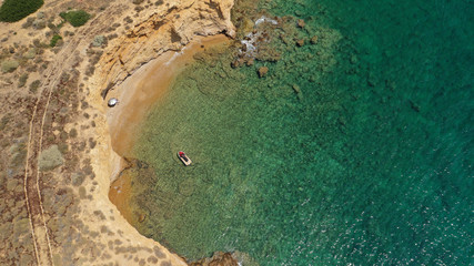Aerial drone photo of famous seascape of Kato Koufonisi island with caves and steep rocks and emerald clear sea, Small Cyclades, Greece