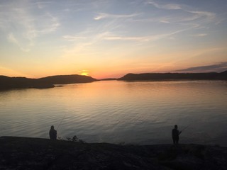 silhouette of couple on beach at sunset