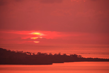 Fototapeta premium Aerial view of sunset and West End of Roatan, Bay Islands, Honduras, Central America