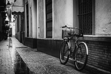 Fototapeta na wymiar Bicycle Leaning Against a Wall In Alley