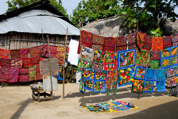 Central America, Panama, San Blas Islands (aka Kuna Yala). Colorful Kuna Indian hand stitched molas on display.