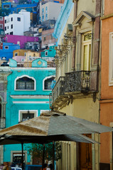 Fototapeta na wymiar Mexico, Guanajuato. Densely packed assortment of multicolored buildings up a hillside. Credit as: Nancy Rotenberg / Jaynes Gallery / DanitaDelimont.com