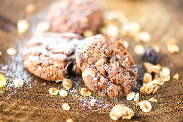 cookies with icing sugar and wood background