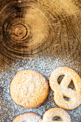 cookies with icing sugar and wood background