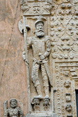 Mexico; Yucatan; Merida. The left-most of two politically incorrect figures of a conquistadore standing on the heads of two vanquished Indians that adorn the entrance to the Casa de Montejo.