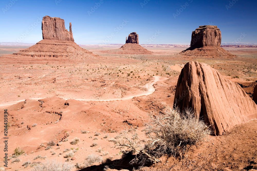 Wall mural USA, Arizona, Monument Valley. The Mittens as seen from the Monument Valley Navajo Tribal Park's visitor center.