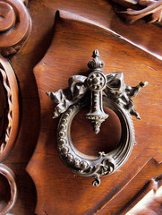 Uruguay, Montevideo. A traditional wooden door and brass handle.