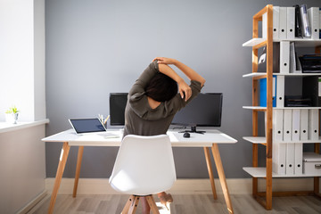Businesswoman Stretching Her Arms